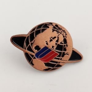 Vintage United Airlines metallic, copper-toned pin with black accents